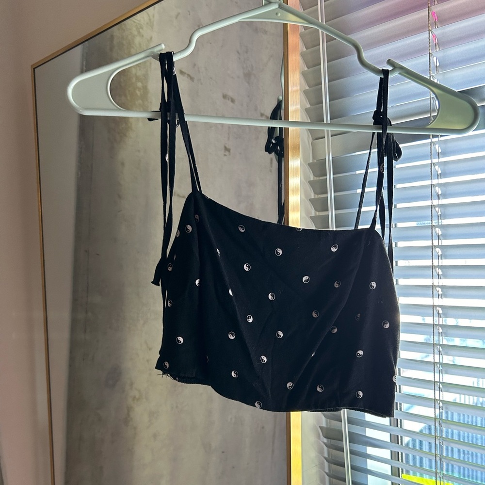 Black crop top with ying yang symbols